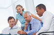 Business people looking at a digital tablet