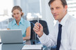 Business man holding a pen 