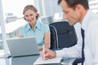 Business people working together in the same office