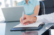 Close up of businessman writing