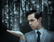 Businessman holding hand out over matrix
