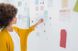 Designer standing in front of material samples