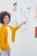 Attractive designer standing in front of material samples