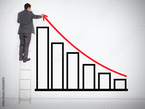 Photo: Businessman drawing red line above bar chart Businessman drawing red line above bar chart