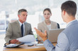 Serious business people listening to applicant