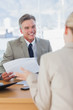 Businessman smiling at applicant