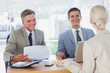 Happy business people smiling and interviewing candidate