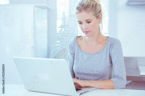 Photo: Woman using her laptop Woman using her laptop
