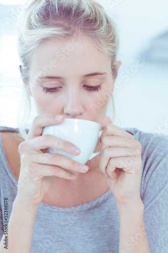 Photo: Woman drinking a cup of tea Woman drinking a cup of tea