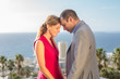 Couple holding hands on balcony