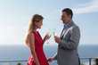 Couple clinking their flutes of champagne