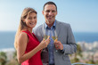 Delighted couple clinking champagne
