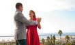 Couple dancing together on the balcony