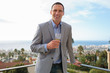 Attractive man holding glass of champagne
