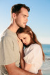 Cute couple relaxing on the beach