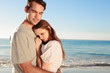 Cheerful couple relaxing on the beach