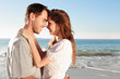 Attractive couple relaxing on the beach 