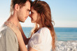 Romantic couple relaxing on the beach 