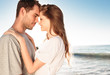 Romantic couple relaxing and embracing on the beach 