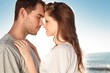 Attractive couple embracing on the beach 