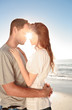 Young couple embracing on the beach 