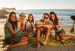 Friends having a barbecue party on the beach