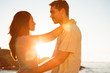 Young couple embracing each other on the beach
