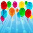 balloons of different color on a background blue sky