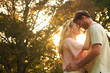 Lovers relaxing in a park under the sun