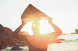 Surfer holding his surfboard and looking at the sea