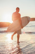 Attractive man walking in the sea