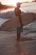 Silhouette of an attractive man looking at the sea