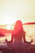 Silhouette of woman meditating