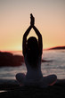 Silhouette of a woman doing yoga