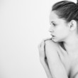 Beautiful young woman topless in black and white