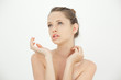 Pretty young woman standing topless
