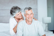 Mature woman giving a massage to her husband