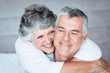 Woman embracing her husband in the bed