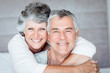 Mature woman embracing her husband
