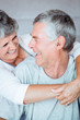 Retired couple laughing together