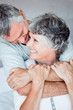 Mature man embracing his wife