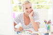 Happy designer working with a colour wheel