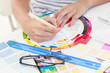Female designer working on a colour wheel