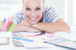 Female designer posing at her desk