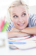 Happy designer posing on her desk