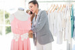 Attractive fashion designer on the phone