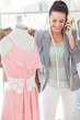 Cheerful fashion designer on the phone