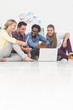 Team of creative designers sat on the floor