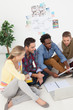 Dynamic team of creative designers sat on the floor