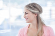 Pretty blonde woman standing in her office